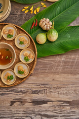 Traditional Vietnamese Food in wooden table with Green background
