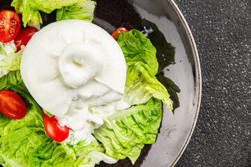 Salad burrata cheese buffalo milk cheese salad dish fresh gourmet food background on the table rustic food top view copy space keto and paleo diet vegetarian