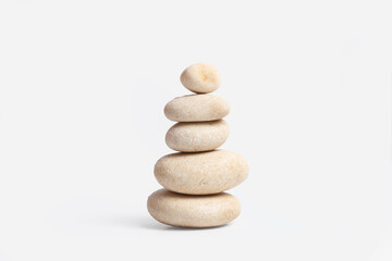 A heap of a white boulders on a white background with copy space