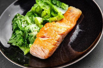 Salmon fish fried seafood dish fresh gourmet food background on the table rustic food top view copy space pescetarian diet