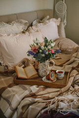 Beautiful breakfast in bed with flowers
