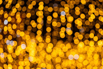 Glowing bokeh lights for festive atmosphere or holiday celebration background.