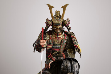 3D illustration of the upper body of a samurai wearing traditional Japanese armor and holding a sword..