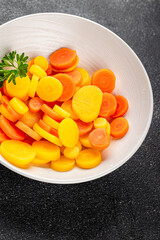 Carrot rings slice boiled vegetable dish fresh gourmet food background on the table rustic food top view copy space vegetarian and vegan food