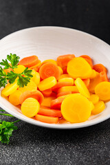Carrot rings slice boiled vegetable dish fresh gourmet food background on the table rustic food top view copy space vegetarian and vegan food