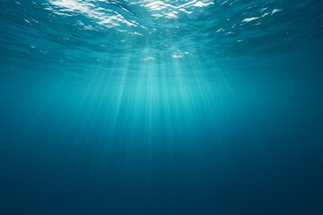 Underwater ocean surface light rays captured as natural scenic background ideal for relaxing desktop wallpapers, travel ads, calming mobile screens, and premium marketing visuals