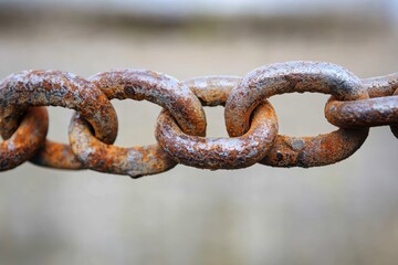 Fototapeta premium Weathered steel chains showcase rustic strength in a close up shot emphasizing texture and enduring character