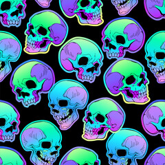 Seamless pattern of bright human skulls on a black background
