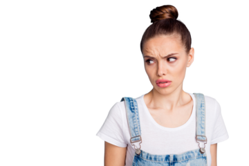 Portrait of upset person looking at copy space grimacing wearing white t-shirt denim jeans isolated over blue background