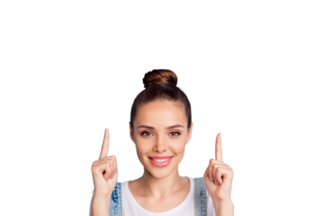 Close up photo of lovely girl showing her index finger up at copy space  wearing white overalls isolated over blue background