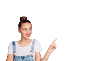 Portrait of attractive girl looking at ads wearing white t-shirt denim jeans overalls isolated over blue background
