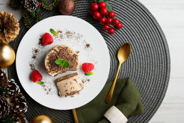 Chocolate and coffee mousse tartlets. Top view table with christmas decorations.