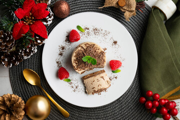 Chocolate and coffee mousse tartlets. Top view table with christmas decorations.