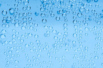Soda water with bubbles as background, closeup