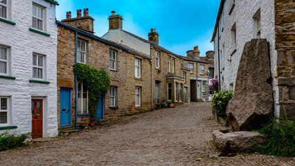 An ancient cobbled street in the village of Dent in the English Yorkshire Dales National Park