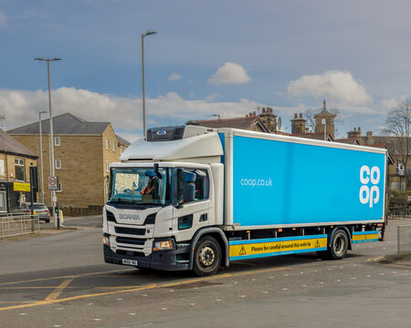 Lorry decorated with Co-op logo and web address delivers products from their central warehouse to keep their many Co-operative supermarkets and stores well stocked