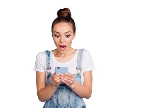 Photo of girlfriend amazedly staring at her phone screen seeing something incredible while isolated with blue background