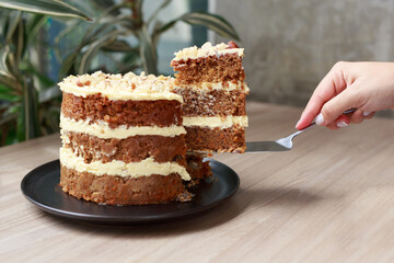 Carrot Cake with Cream Cheese Frosting Being Served