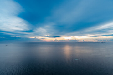 Dreamy sunset on tropical sea in Pattaya, Thailand. beautiful landscape of seascape with water reflection from sunlight. background for traveling and vacation.