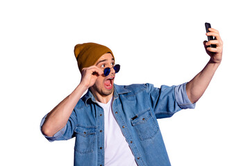 Photo of shouting attractive handsome holding telephone with hands taking selfie wearing brown cap...