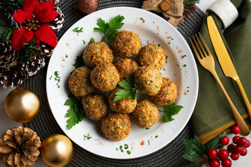 Fried chickpea falafel balls with parsley sprigs. Top view table with christmas decorations.