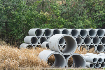Concrete drainage pipes for industrial building construction.