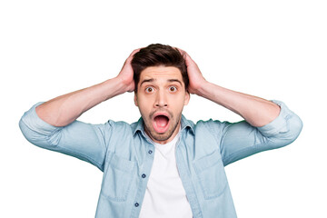 Photo of crazy horrified fearful man holding his head after having known the worst news in the...