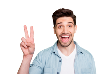 Portrait of cheerful crazy excited overjoyed man having noticed his old acquintance and saying hi to him by showing v-sign isolated over green vivid color background