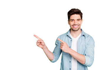 Photo of amazing salesman guy in excited mood indicating finger to empty space advising cool...