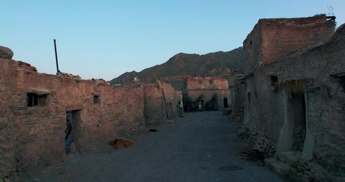 Abandoned village in the mountains of Yemen, perfect for illustrating postapocalyptic settings, lost civilizations, deserted landscapes in creative projects.
