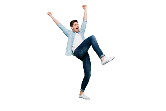 Full body profile photo of carefree crazy guy yelling celebrating favorite football team victory raise fists and leg wear denim shirt isolated green color background