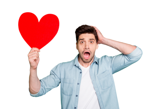 Photo of amazing guy holding big red paper heart forgot about romance surprise for girlfriend open mouth wear denim shirt isolated green color background