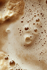 Creamy cappuccino foam with swirling patterns and bubbles, a macro and full-frame texture shot, close-up texture, top view