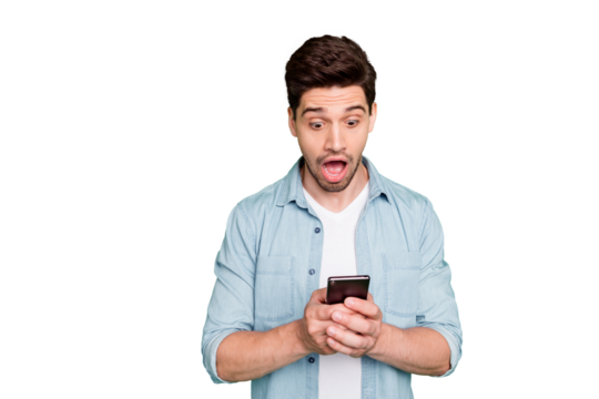 Photo of amazing guy holding telephone read instagram post negative comments not believe eyes open mouth wear denim shirt isolated green color background
