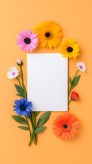 White blank paper surrounded by paper colorful flowers isolated on background