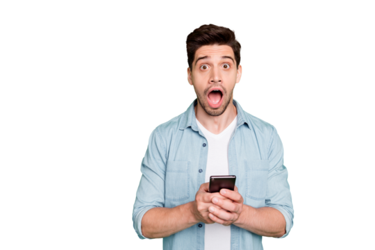 Photo of amazing guy holding telephone read instagram post negative comments not believe eyes open mouth wear denim shirt isolated green color background