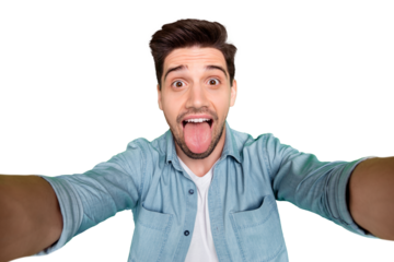 Closeup photo of handsome guy crazy playful mood making selfies sticking tongue out mouth wear denim shirt isolated green color background
