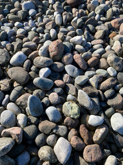 Big grey rocks or stones on a beach creating a textured background