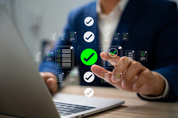 Digital document verification, Businessman using laptop and tablet to approve digital document,...