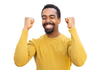 Victorious male celebrating, pumping fists high with jubilant emotion against clear backdrop