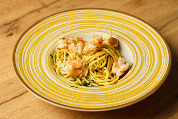 Shrimp pasta dish served on a wooden table