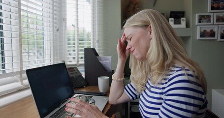 Woman, neck pain and laptop in remote work from home, fatigue or typing with stretching, muscle and glasses. Girl, headache and freelance with burnout, tired or stress for analysis, report or project - Powered by Adobe