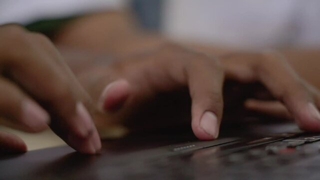 Close up of male finger using a laptop trackpad scrolling website for shopping online and browsing the internet. Asian male Hand using a laptop touch pad searching for knowledge and information.