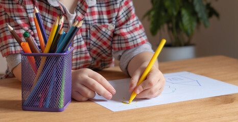 boy draws, draw with pencils
