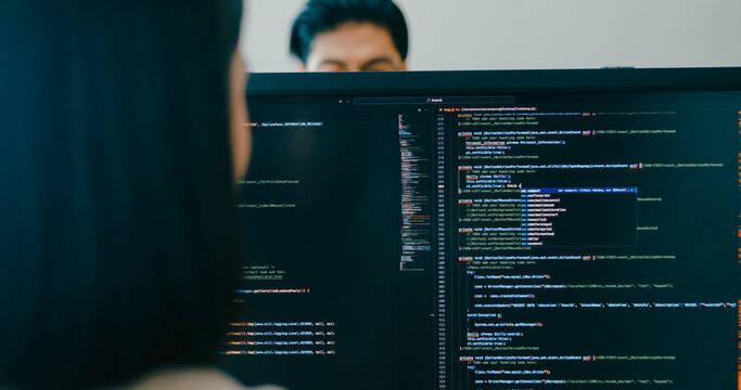 Closeup Adult Asia male, female freelance typing write prompt AI bot IT app smart program nomad, video game, terminal with coding language, user interface, designer, big data center desktop computer.