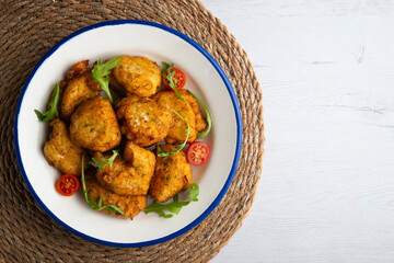 Cod fritters, a traditional Spanish tapa. Top view table.