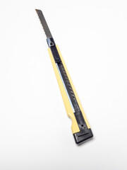 Close-up of a utility knife isolated on a clean white background