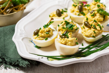 Eggs stuffed with mousse of egg yolk, mayonnaise, mustard and capers.