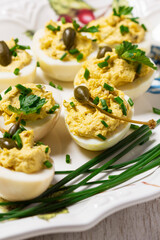 Eggs stuffed with mousse of egg yolk, mayonnaise, mustard and capers.