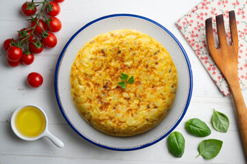 Spanish omelette with potatoes and onion. Top view table.